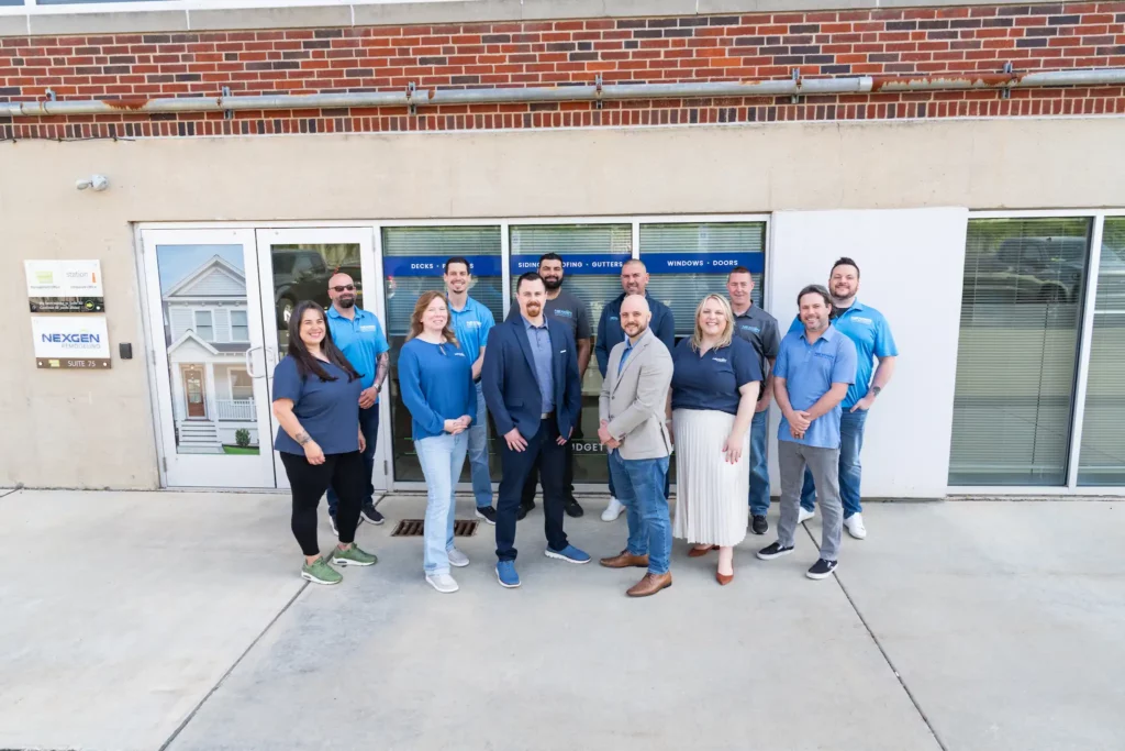 Photo of NexGen Remodeling team members standing in front of their office.