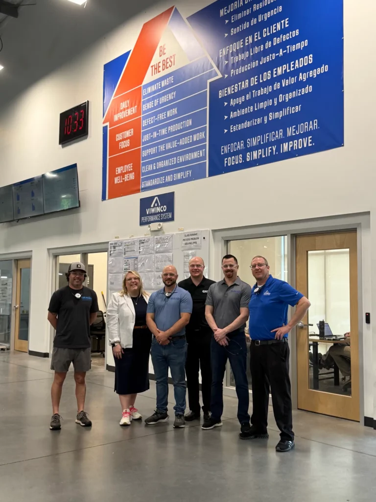 Photo of NexGen team members taking a tour of Viwinco's window plant.
