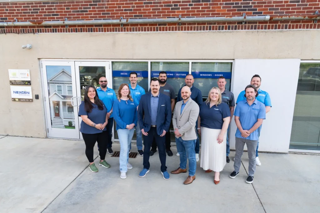 Group photo of the NexGen Remodeling team members standing in front of their office. A Team You Can Count On.