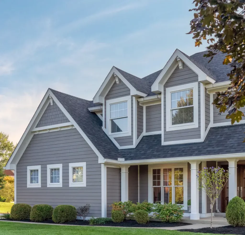 Two story home with plank aged pewter siding protected by James Hardie warranty which boosts home value.