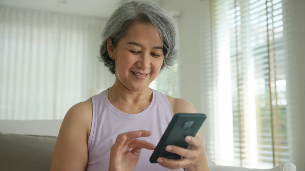 Woman scrolling on her mobile phone.