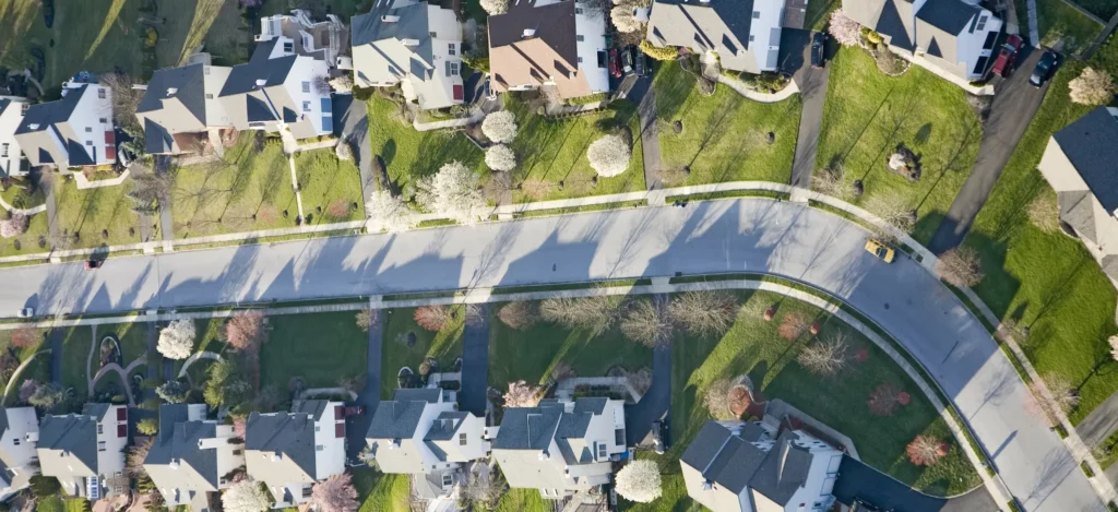 Drone aerial photo of a quiet neighborhood street.