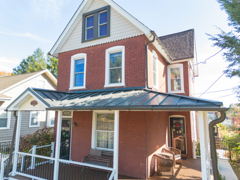 Wraparound Porch & Roof Replacement - After